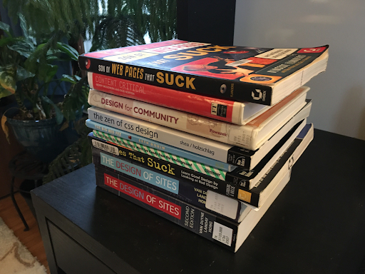 A stack of books on my desk with titles like 'web pages that suck' and 'the zen of css design'